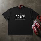 GRACE Cross oversized tee in black flat lay — white GRACE print with crucifix, Christian streetwear