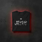 JESUS Crown oversized tee in black folded — distressed JESUS wordmark under cross-topped crown, KingJesus.shop