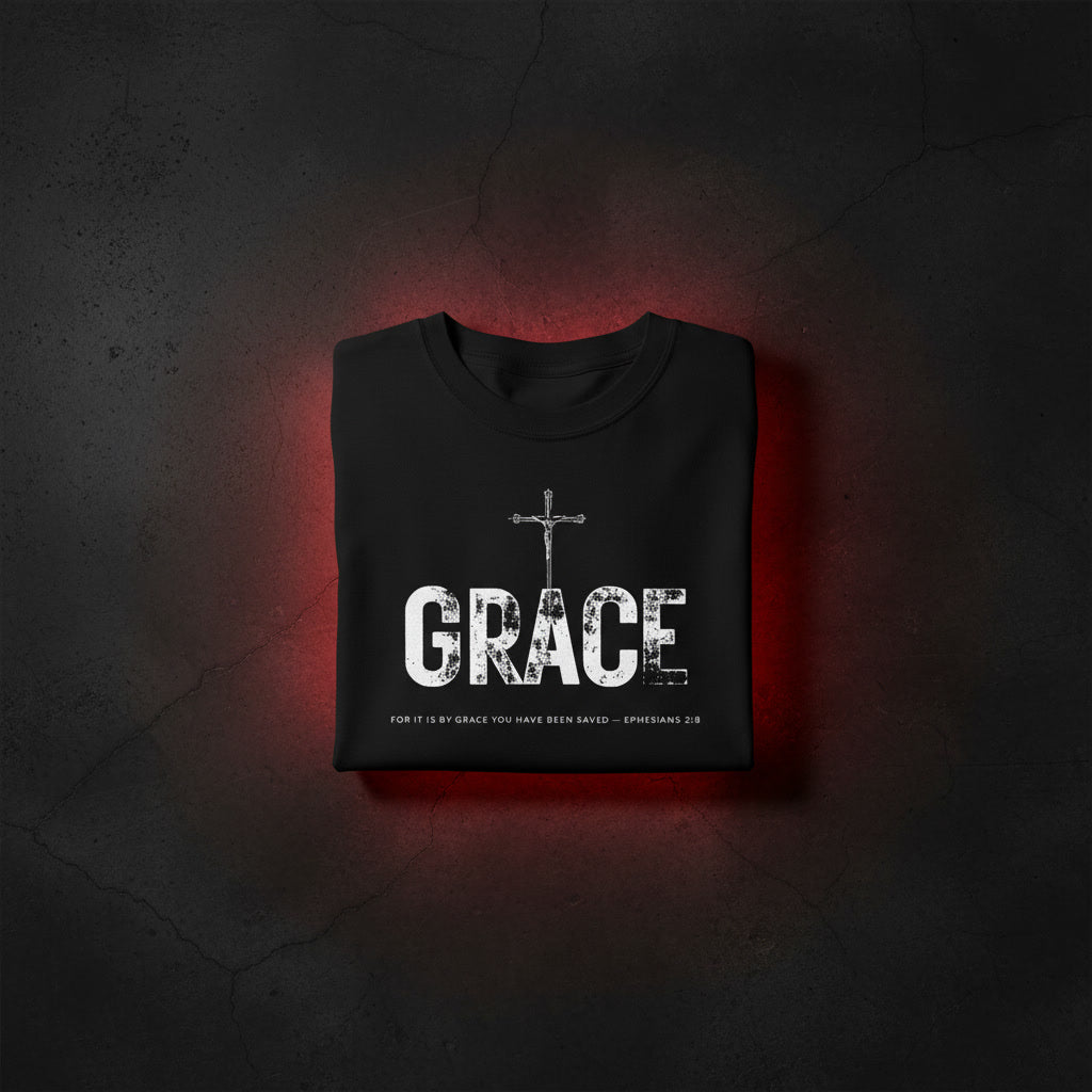 GRACE Cross oversized tee in black folded — crucifix standing through distressed GRACE letters, Ephesians 2:8, KingJesus.shop