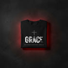 GRACE Cross oversized tee in black folded — crucifix standing through distressed GRACE letters, Ephesians 2:8, KingJesus.shop