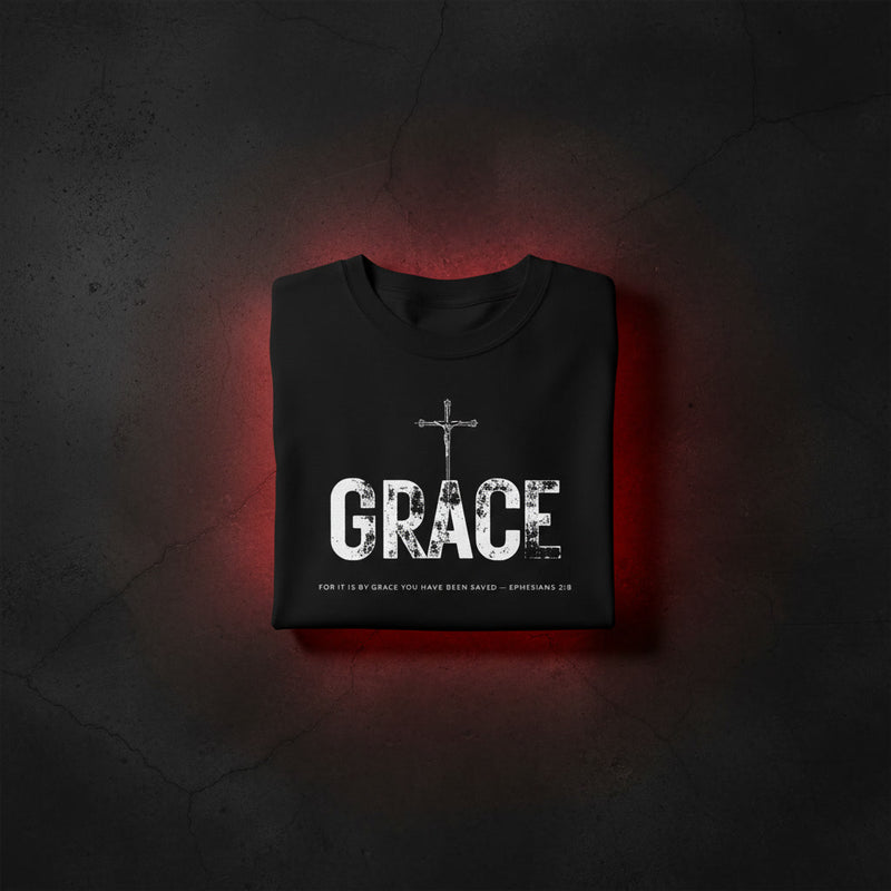 GRACE Cross oversized tee in black folded — crucifix standing through distressed GRACE letters, Ephesians 2:8, KingJesus.shop
