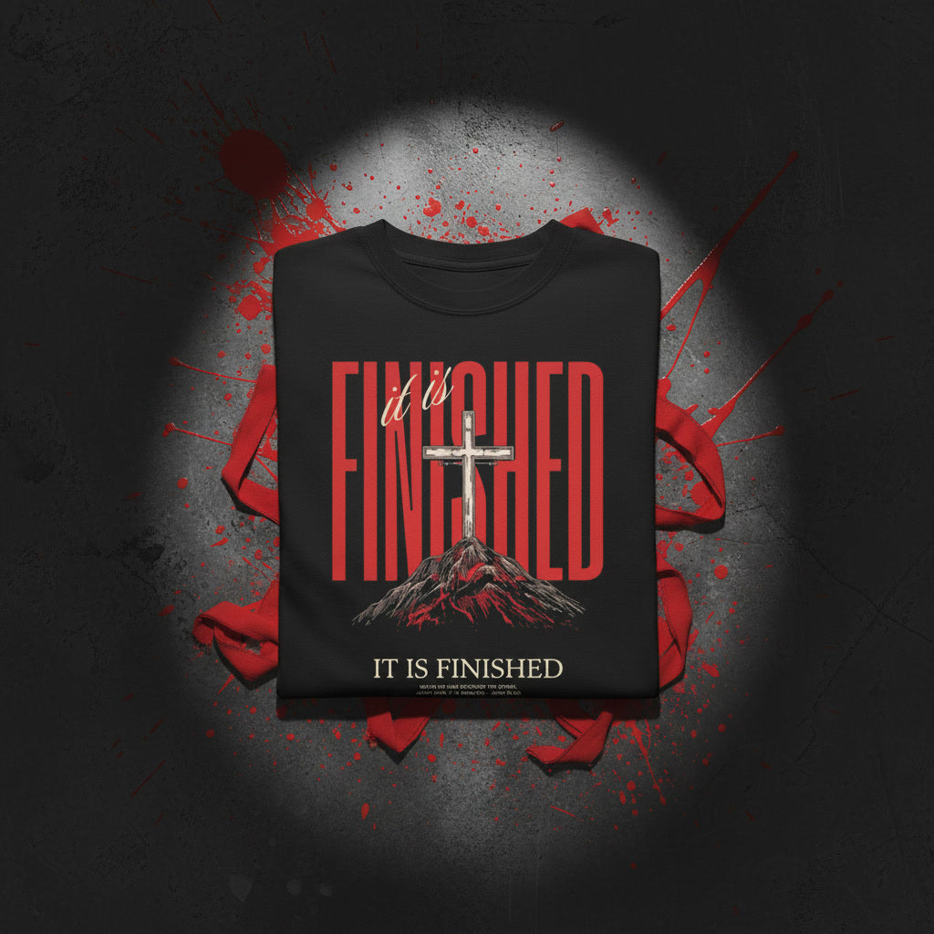 It Is Finished oversized tee in black folded — red FINISHED type with cross on the hill, Christian streetwear