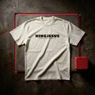BLESSED oversized tee folded on dark concrete — garment-dyed heavyweight cotton